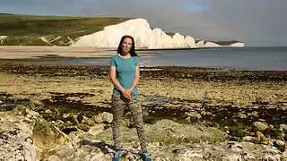 Henri Brocklebank, Director of Conservation, Sussex Wildlife Trust, standing on a beach in Sussex
