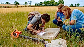 People monitoring a grassland