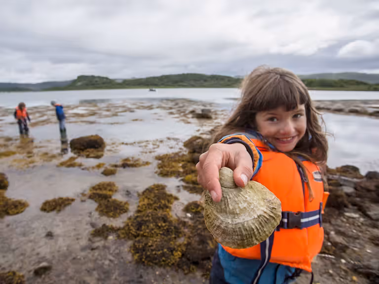 Child showing oyster as part of Seawilding's oyster reintroduction