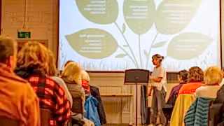 People sat listening to a talk at a Yorkshire Rewilding Network event.